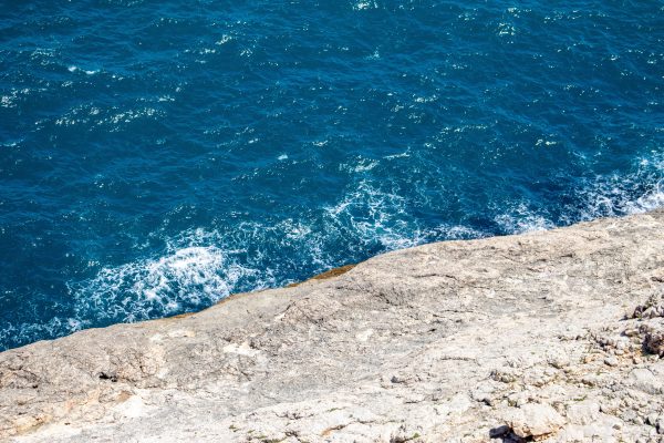 A breathtaking view of the clear blue Aegean Sea meeting the rocky shores of Istanbul. Nature 4K