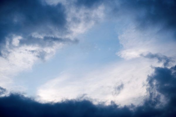 A dramatic cloudy sky in Hyderabad, capturing a moment of contrast between dark and light clouds. Dark 4K