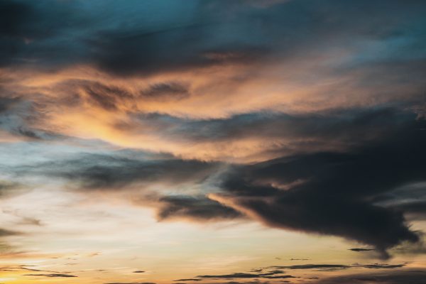 A dramatic sky at sunset with vibrant colors and swirling clouds. Nature 4K