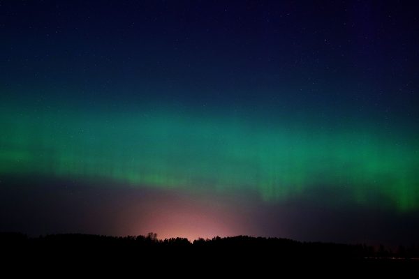 A mesmerizing display of the Aurora Borealis in the night sky over Ventspils, Latvia. Espace 4K