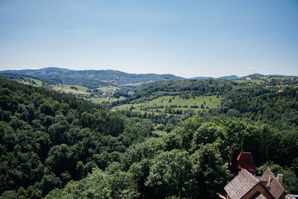 A picturesque landscape of rolling hills and lush forests in Zagórze Śląskie, Poland. Nature 4K