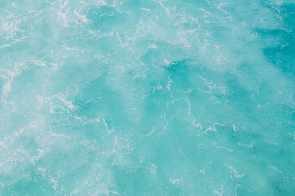 A soothing view of turquoise ocean waves forming natural, artistic patterns. Nature 4K