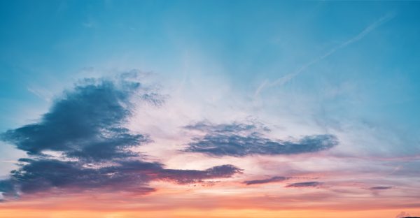 A stunning sunset sky filled with vibrant colors and dramatic cloud formations, capturing nature's beauty. Nature 4K