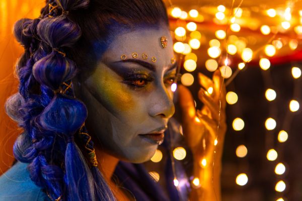 A vibrant portrait with artistic makeup and colorful bokeh lights. Geek 4K