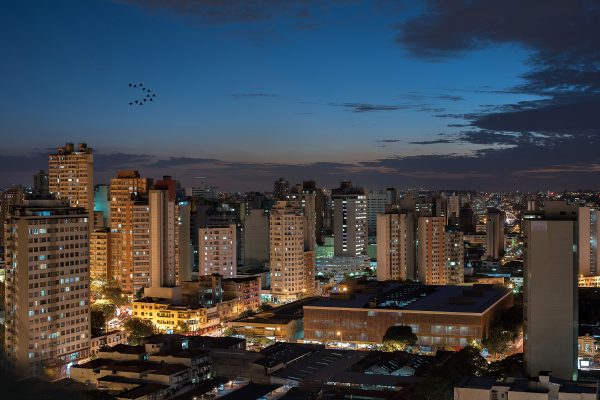 Aerial view of illuminated buildings in Belo Horizonte, Brazil, at dusk. Architecture 4K