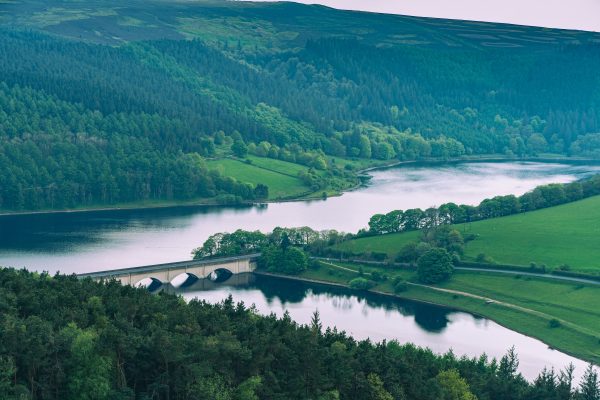 Aerial view of Ladybower Reservoir and surrounding landscape in England during summer. Architecture 4K