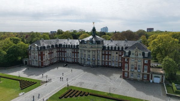 Aerial view of the historic Schloss Münster, a renowned German landmark. Nature 4K