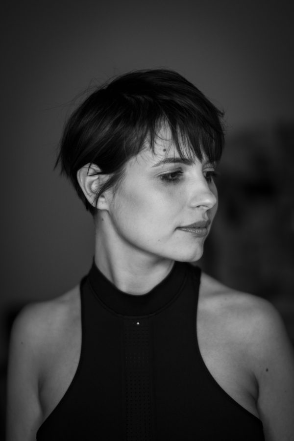 Artistic black and white portrait of a woman with a calm expression, highlighting elegance. Mobile 4K