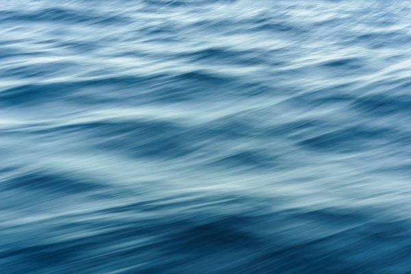 Artistic blur effect of ocean waves capturing fluid motion and dynamic texture. Nature 4K