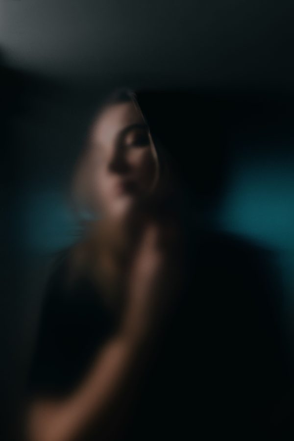 Artistic soft-focus portrait with a dreamy, blurred aesthetic, evoking mystery. Mobile 4K
