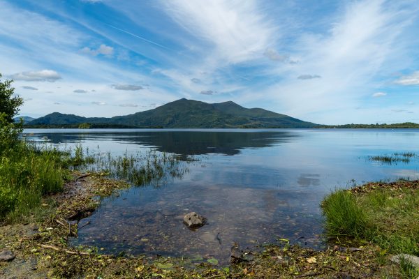 Beautiful landscape of Lough Leane with mountains and blue sky in Killarney National Park, Ireland. Nature 4K