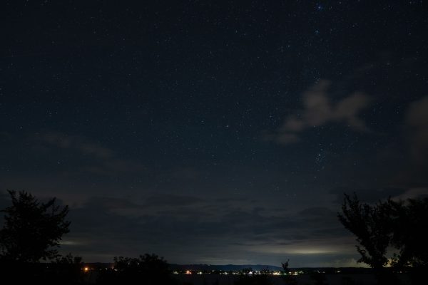 Beautiful night sky filled with stars over a rural landscape in Maple Springs, Minnesota. Dark 4K