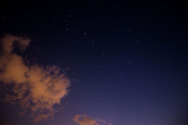 Beautiful starry night sky with soft clouds visible from Mönchberg, Germany. Espace 4K
