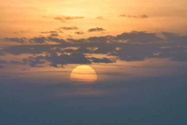 Beautiful sunrise over Poprad with sun partially hidden by clouds. Nature 4K