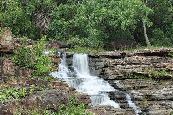Beautiful waterfall cascading through lush greenery in Chhatarpur, Madhya Pradesh. Nature 4K