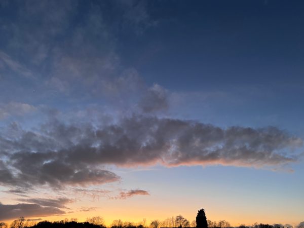 Beautiful winter sunset with dramatic clouds and vibrant colors in the sky. Nature 4K