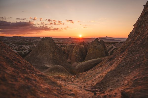 Breathtaking sunset view over the rocky terrain of Cappadocia, Nevşehir, Türkiye. Nature 4K
