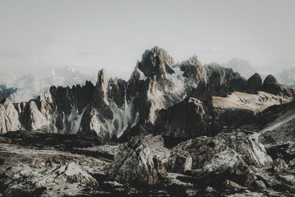Breathtaking view of rugged mountain peaks surrounded by rocks and snow. Nature 4K