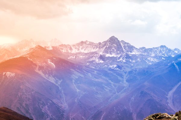 Breathtaking view of snow-covered mountains at sunrise with a vibrant sky. Nature 4K
