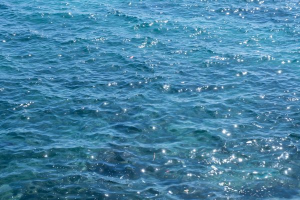 Bright and clear Mediterranean Sea water glistening under the sunlight in Antalya, Türkiye. Nature 4K