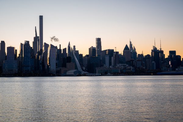 Captivating dawn view of the Manhattan skyline silhouetted against the morning sky. Architecture 4K