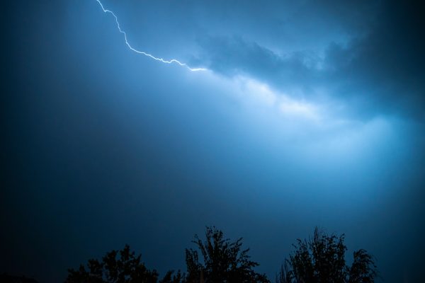 Captivating image of a lightning strike cutting through a dark, stormy sky. Dark 4K