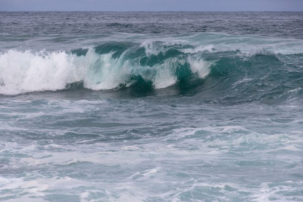 Captivating image of powerful ocean waves crashing onto the shoreline, showcasing nature's dramatic beauty. Nature 4K