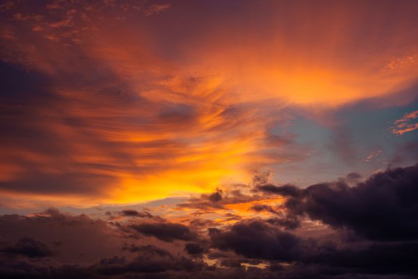 Captivating sunset sky with vivid orange and purple clouds creating a dramatic and serene atmosphere. Nature 4K