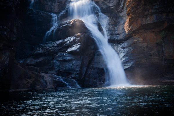 Captivating view of cascading waterfalls flowing over rocky cliffs in Odisha, India. Nature 4K