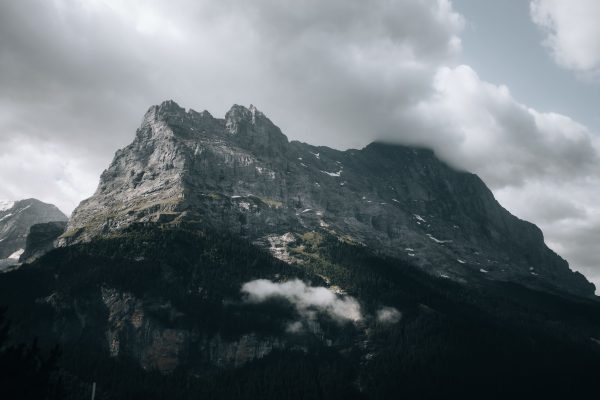 Captivating view of Eiger Mountain under dramatic clouds in Swiss Alps. Nature 4K