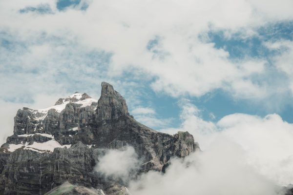 Captivating view of rugged mountain peaks surrounded by clouds in Sixt-Fer-à-Cheval, France. Nature 4K