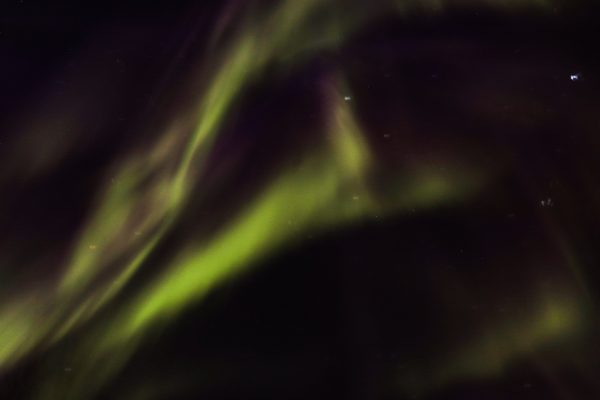 Capture of vibrant aurora borealis dancing in the clear night sky. Espace 4K