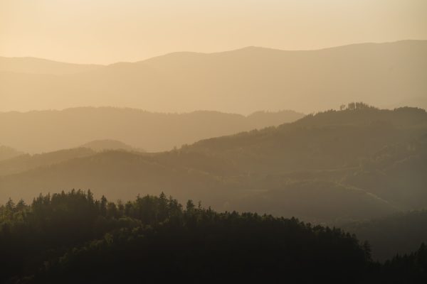 Capture the tranquil layers of Graz's rolling hills at sunset, radiating a peaceful ambiance. Nature 4K