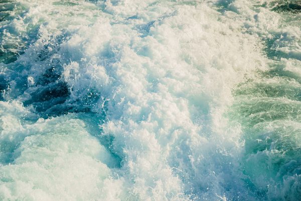 Cascading ocean waves with frothy white foam create a dynamic, mesmerizing pattern. Ideal for nature or travel themes. Nature 4K