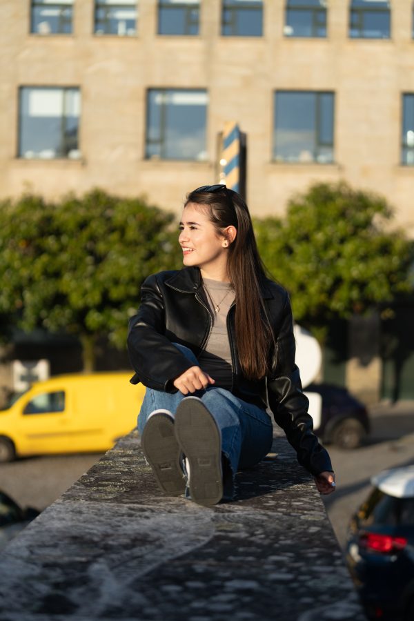 Caucasian woman enjoying a sunny day outdoors in Santiago de Compostela, Spain. Mobile 4K