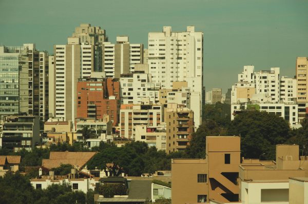 Cityscape featuring a skyline of tall, modern buildings against a clear sky. Architecture 4K