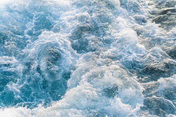 Close-up view of powerful ocean waves with frothy texture and dynamic movement. Nature 4K