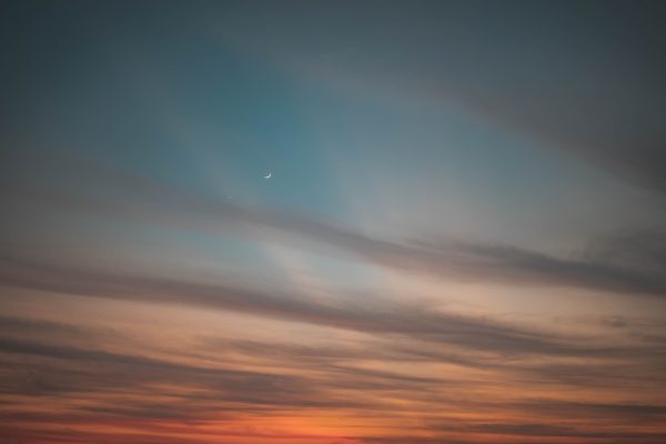 Crescent moon against a tranquil twilight sky, perfect for nature themes. Nature 4K