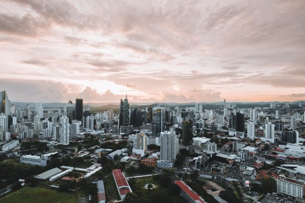 Dramatic aerial view of Panama City skyline during sunset showcasing modern skyscrapers. Architecture 4K