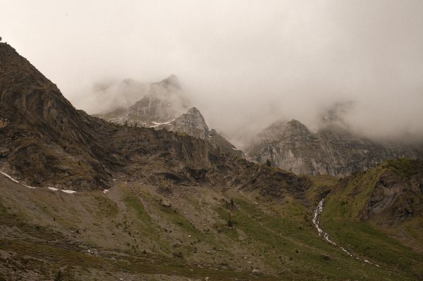 Dramatic view of the misty Swiss Alps in Wolfenschiessen, Switzerland. Nature 4K
