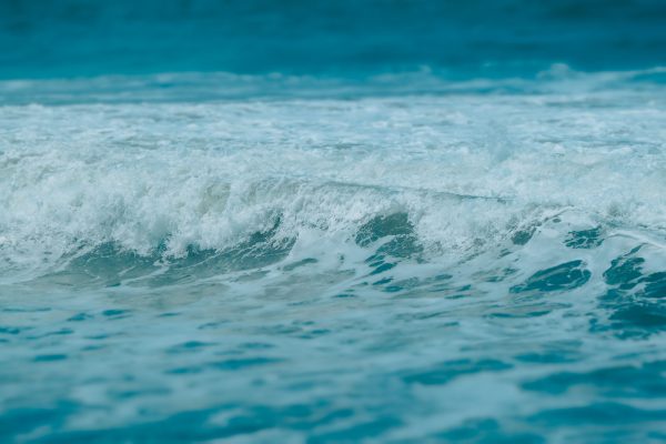 Dynamic close-up shot of turquoise ocean waves capturing the essence of the sea. Nature 4K