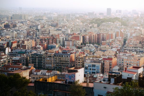 Expansive aerial view of Barcelona, showcasing diverse architecture and vibrant city life. Architecture 4K