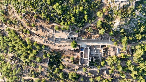 Explore the stunning ruins surrounded by lush greenery from an aerial perspective in Antalya, Türkiye. Nature 4K