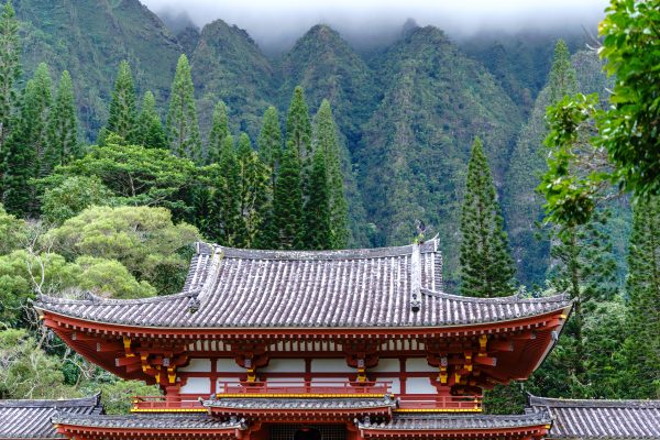 Explore the tranquil beauty of a Japanese temple set against lush Hawaiian mountains. Anime 4K