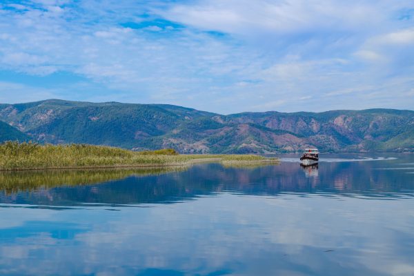 Explore the tranquil beauty of Dalyan, Türkiye with serene waters and lush hills. Nature 4K