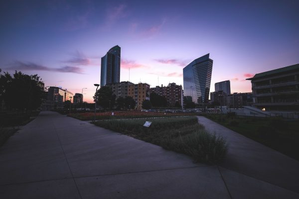Explore this mesmerizing urban cityscape at twilight, capturing modern skyscrapers against a vibrant sunset sky. Architecture 4K
