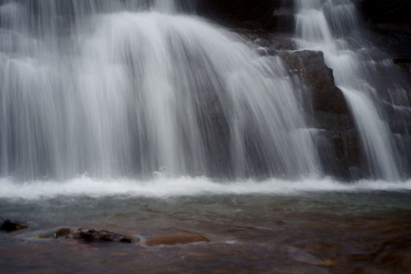Gentle cascade of a waterfall in Idukki, Kerala, India, flowing gracefully over rocks. Nature 4K