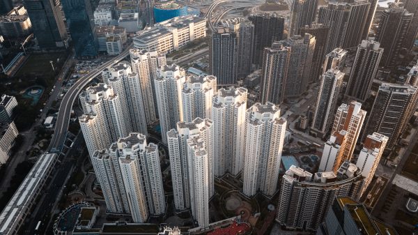High-rise residential buildings in Kowloon, Hong Kong captured from above showcasing urban density. Architecture 4K