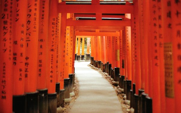Iconic orange torii gates of Fushimi Inari Taisha shrine in Kyoto, Japan, symbolizing a spiritual pathway. Anime 4K