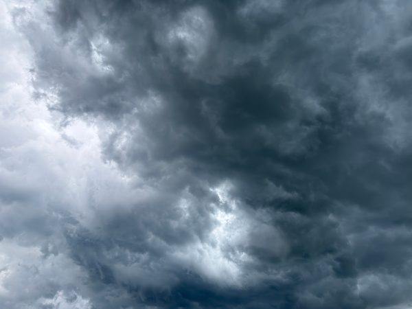 Intimidating storm clouds gather, creating a dramatic and moody atmosphere. Dark 4K